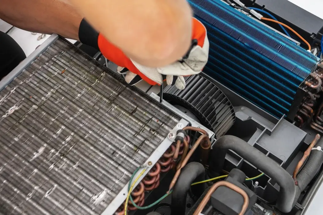 Service technician repairing the internal components of an RV unit